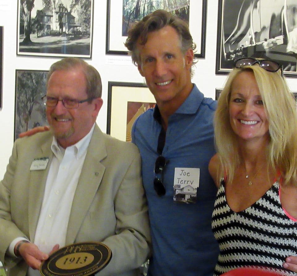 Pleasanton Mayor Jerry Thorne presenting a historic plaque to Joe and Katie Parr